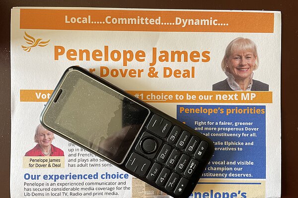Penelope James leaflet and a mobile phone